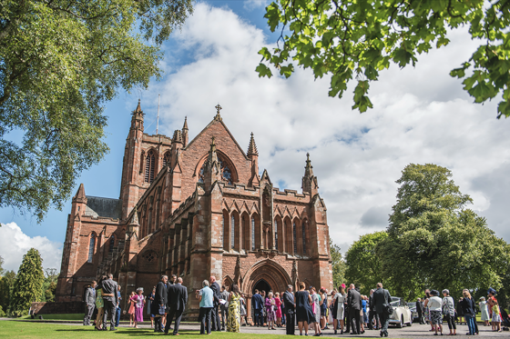 External view of Crichton Memorial Church with guests outside on a sunny day.